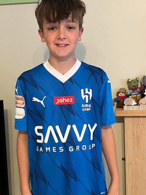 Young MJK customer wearing an Al Hilal shirt from his Kids' Mystery Football Shirt Box