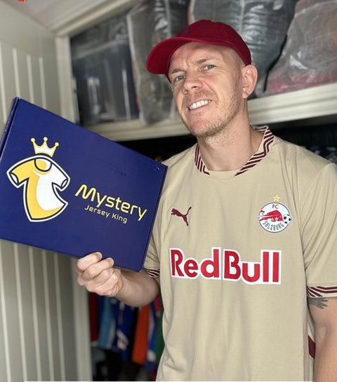MJK customer holding his Mystery Jersey King box in a Red Bull Salzburg shirt